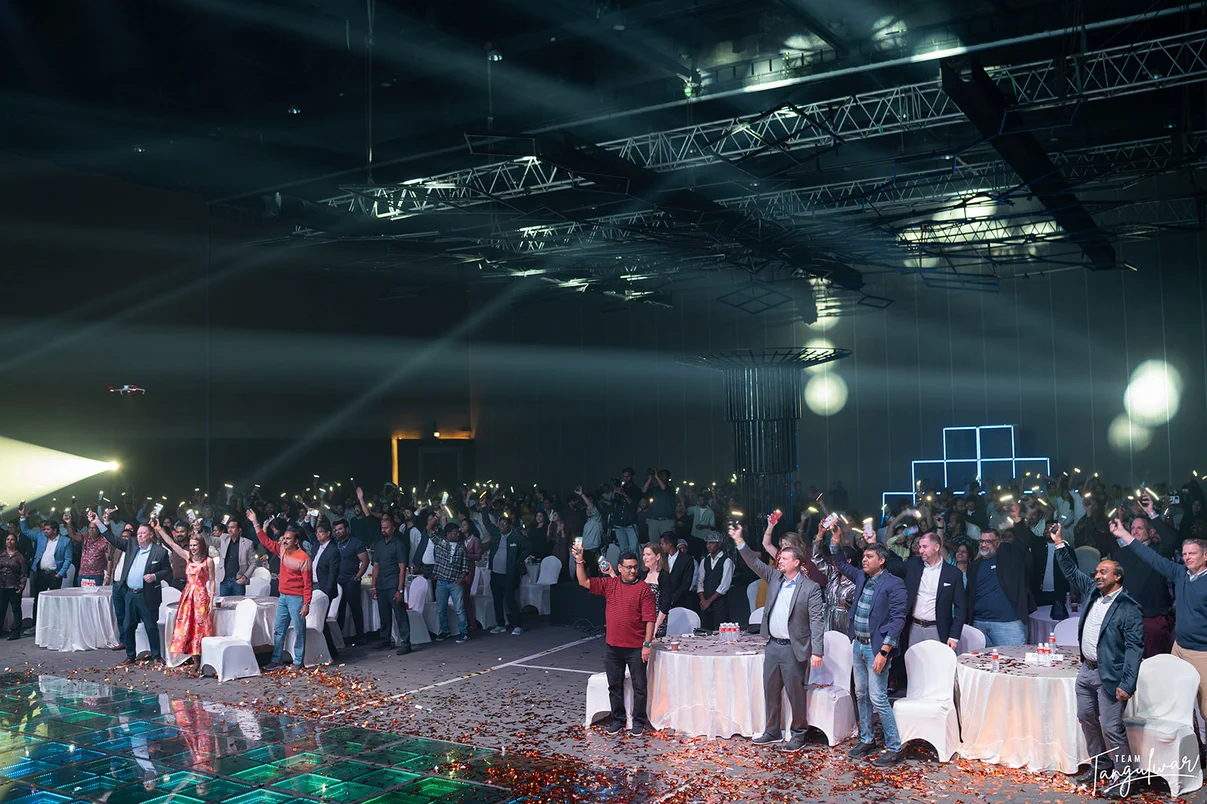 Employees and their families celebrating together at a corporate family day event by Shaahi Creations